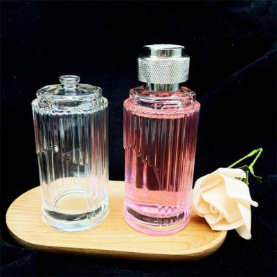 China Cosmetic Round 150ml Transparent Irregular Glass Perfume Bottles With Aluminum Caps for sale