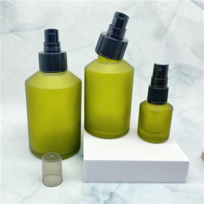 China 15ml 100ml 200ml Cosmetic Oblique Shoulder Perfume Dark Green Perfume Bottles With Black Cap for sale