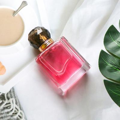 China New Sale 60ml Glass Cosmetic Perfume Bottles With Black Caps for sale