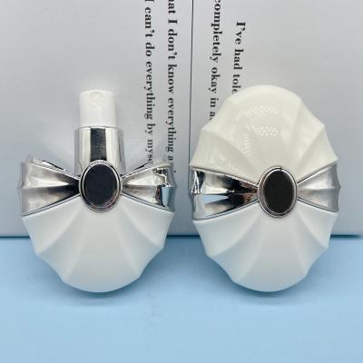 China 50ml Cosmetic Egg Shape Plastic Empty Spray Pump Perfume Bottles for sale