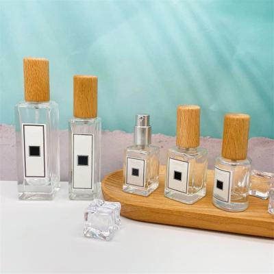 China 5ml 10ml 18ml square cosmetic clear rectangle shape spray glass refillable perfume bottle with bamboo cap for sale