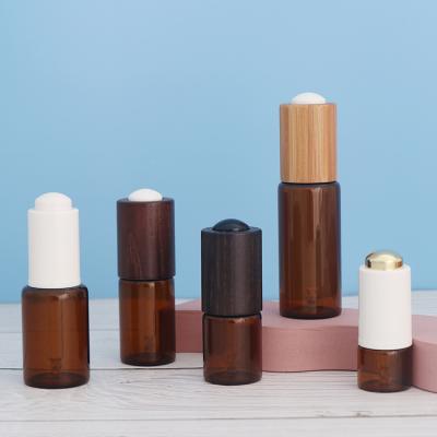 China 5ml 10ml 15ml 20ml 30ml Cosmetic Bamboo Press Pump Dropper Essential Oil Glass Bottles for sale