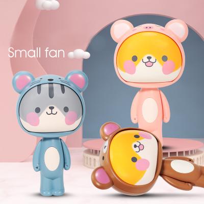 China Free To Spill Cute Mini Portable Handheld Press Pocket Fan Hand Press Change Doll Kids Cartoon Children Cool Summer Present for sale