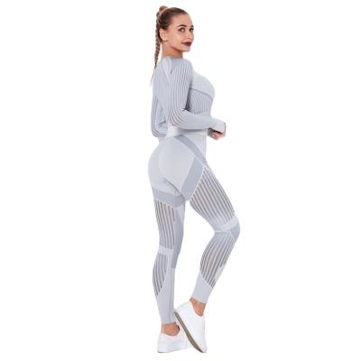 China 2022 Seamless Hollow Fitness Yoga Suit Long Sleeve Breathable Running Yoga Pants Women Custom Moisture Absorption for sale