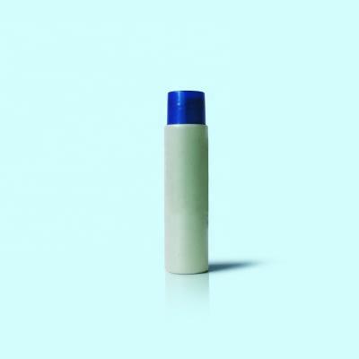 China Wholesale Cosmetic PET Material Round 35ml Shampoo Bottle With Flip Lid for sale