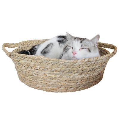 China Durable Natural Handcrafted Grass Woven Round Pet Bed Wicker Rattan Bed Cats Bed Durable Basket For Cat Dog Pet Sleep With Pillow for sale