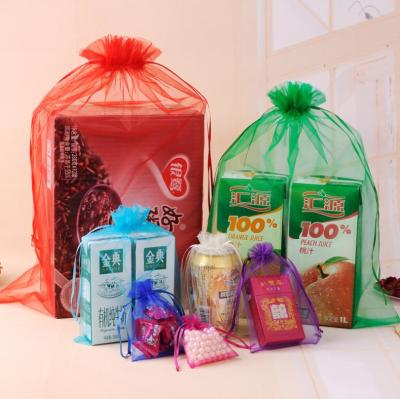 China Custom Logo Biodegradable Large Orange Organza Pouch Drawstring Hair Gift Bags with Ribbon for sale