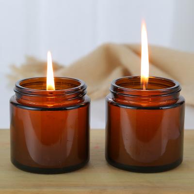 China 50ml 100ml 200ml Pharmaceutical Round Amber Glass Candle Holder Jar With Aluminum Cap for sale