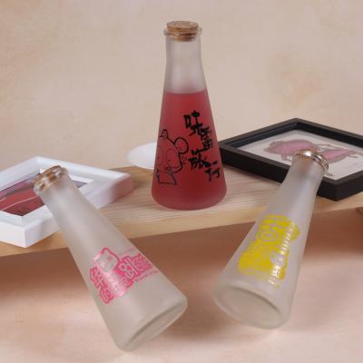 China Outdoor Sanding Beverage Drinkware Juice Cone Glass Bottle Food Bottle With Cork for sale