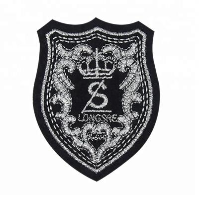 China Custom 3D Fashion Logo Free Sample New Design Low Price Hand Embroidery Gold Bullion Wire Badges for sale