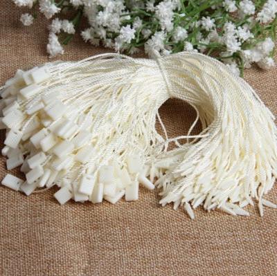 China Durable Ivory Plastic Seal Tag , Commonly Used Nylon String Garment Hang Tag Fastener for sale