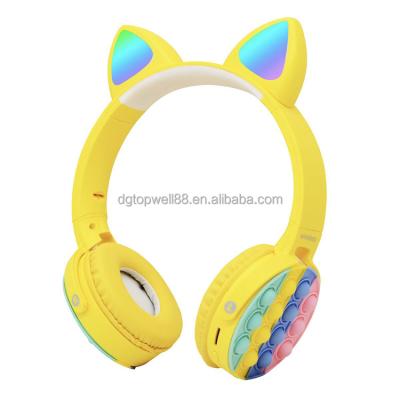 China Popular cute design push bubble led cat popit earbuds wireless headphones for kids for sale