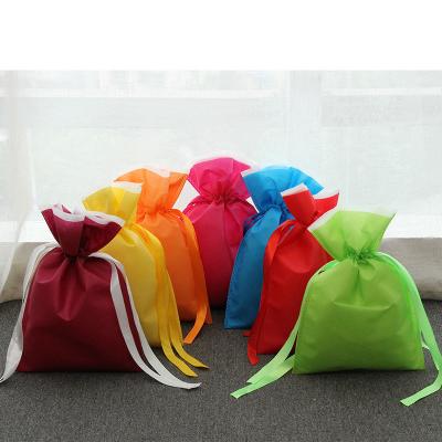 China Recyclable factory stock candy packaging drawstring gift bag multicolor non woven drawstring bags for sale