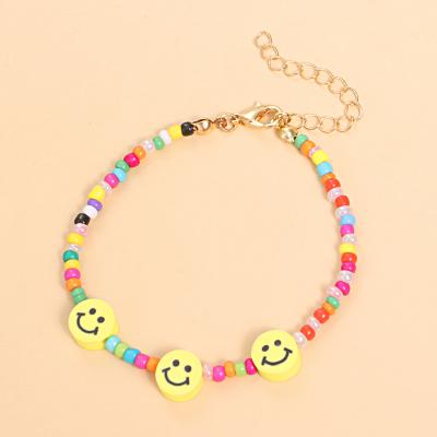 China Popular BOHEMIA ZUOWEN bohemian handcrafted women's bracelet jewelry with multicolored rice beads and smiley face terracotta bracelet for sale