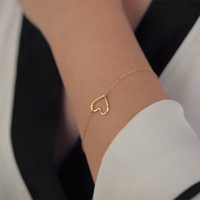 China ZUOWNE Lead Free Nickel Free Factory Directly Sell Simple Women's Alloy Bracelet Hollow Bangle Heart Shaped Jewelry for sale