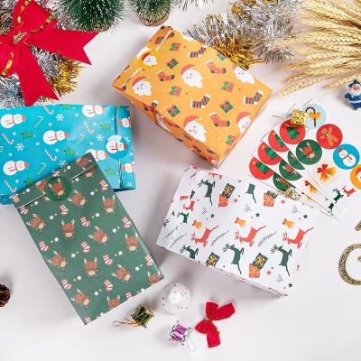 China Recyclable Matching Christmas Gift Giving Gift Paper Candy Bags With Stickers Christmas Treat Bags For Kids for sale