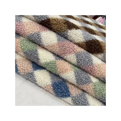 China Hot Selling Dyeing Teddy Faux Fur Fabric Wholesale Low Price High Quality Warm Artificial Wool Plush Fabric for sale