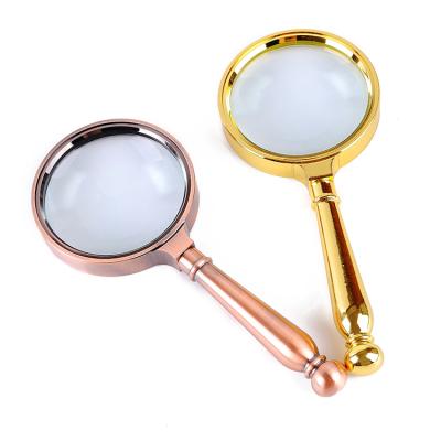 China Protect Eyes 60mm Handheld Magnifier 5X Magnifying Glass Magnifier for sale