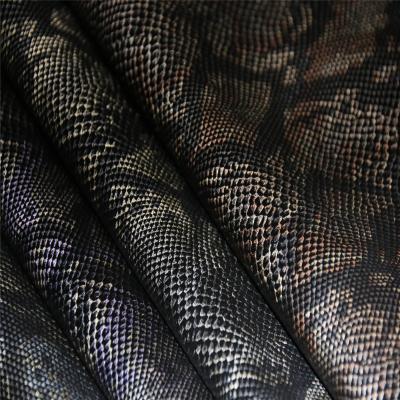 China Trendy hot sale fashionn flocking item snake design rayon backing pu leather for jacket and skirt for sale