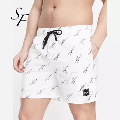 China Custom Summer Anti-Wrinkle Casual Two Pocket Styling Men Swimming Trunk All Over Logo Letter Printed Swim Shorts for sale