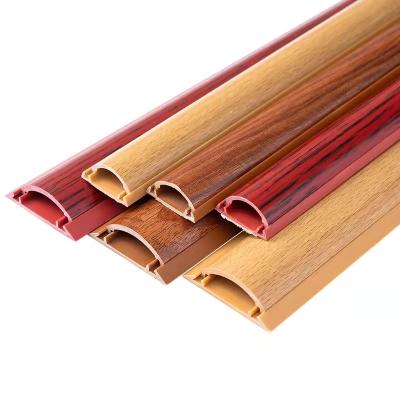 China 2022 Wood Grain Flame Retardant Plastic Insulated Arc Floor Semicircular Slot Waterproof Grooved Cable PVC Trunking for sale