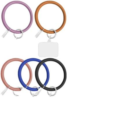 China Nylon+Metal Hot Sale Anti Theft Universal Wrist Silicone Ring Loop Lanyard Strap with Patch for Phone Case for sale