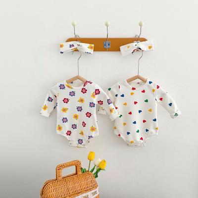 China Europe and America hot selling 2022 spring clothes for infants and children baby love flower printed long sleeve jumpsuit for sale