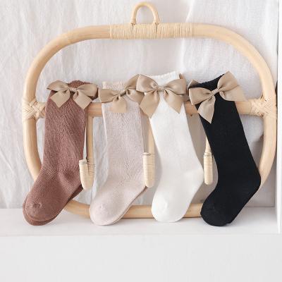 China Baby Antibacterial Newborn Socks With Velvet Bow Winter Cotton Kids Floor Knocks Knee High Baby Kicks Legger Warmer for sale