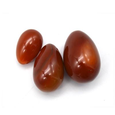 China Red Agate Jade Eggs Drilled Crystal Healing Yoni Eggs Carving Carnelian of China Gemstone Eggs for sale