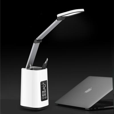 China Modern multi-function foldable arm touch stand pen lamp reading dimmer table lamp with time display for sale