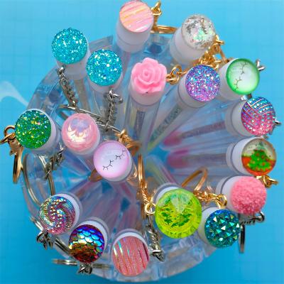 China Mascara container with multicolor eyelash cosmetic tube container hot sale mascara key chain empty mascara tubes with key chain for sale