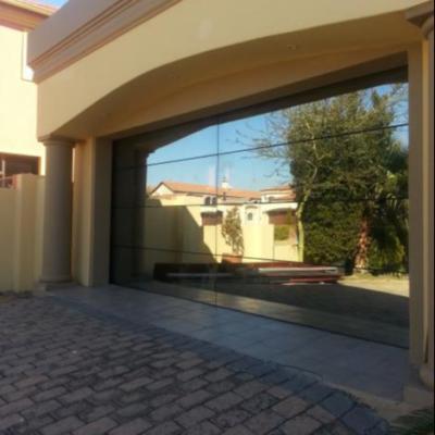 China Modern Frameless Automatic mirror Glass Panels Garage Door prices for sale