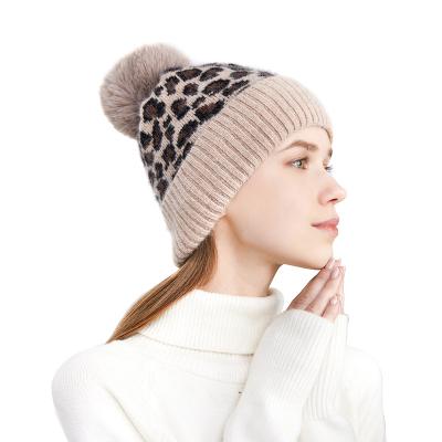 China Casual Women Knitted Beanie Winter Thick Earflaps Knit Hat Cashmere Wool Warm Leopard Pom Pom Beanies for sale