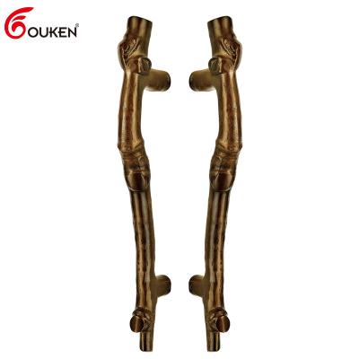 China Modern custom luxury decorative hotel villa long pull handle bronze wooden main door handle for sale