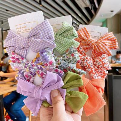 China Luxury Natural Metal Claw Bow Shape Tartan Premium Stitching Flower Bows Custom Wholesale For Girls Hair for sale