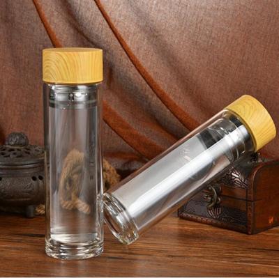 China Sustainable customized logo printing on bamboo bottle or lid, double wall borosilicate glass water bottle with infuser for sale