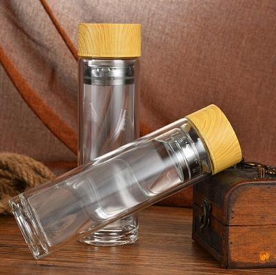 China Viable with customized logo printing on bottle, borosilicate glass water bottle with bamboo lid and tea infuser for sale