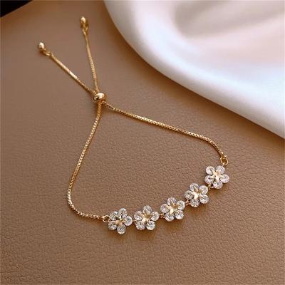 China FASHIONABLE Elegant Rhinestone Inlaid Korean Bracelets Gold Color Flower Charm Bracelet For Women Fashion Jewelry Accessories Party Gifts for sale