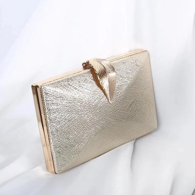 China PU Luxy Dangle Women's Evening Party Clutch Bag Gold Purse Ladies Handbag Party Purse For Bridal Metal Leaf Lock Shoulder Bag for sale