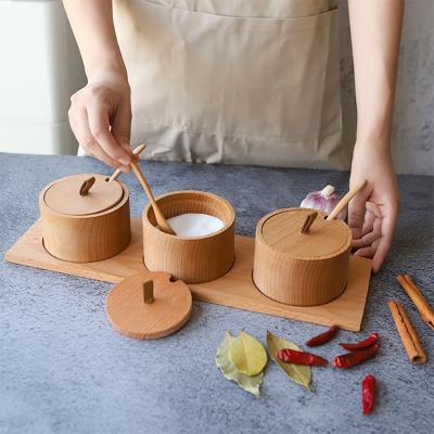 China Modern Salt Jar Condiment Container Round Wooden Spice Jar With Lid And Spoon for sale