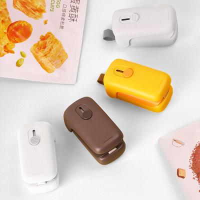 China 2022 New Mini Cutter Sealer Food Amazon Food Saver Plastic Bag Packing Sealing Machine Handheld Portable for sale