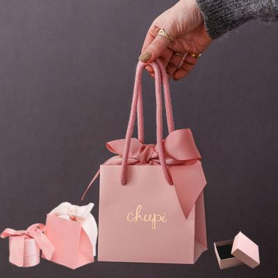 China Elegant luxury black pink boutique recyclable wholesale private label jewelry gift packaging shopping small paper bags with your own logo for sale