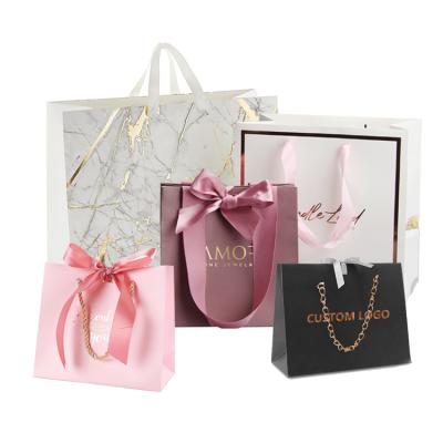 China Recyclable Luxury Matt Black Gold Laminated Branded Cut Patch Handle Retail Gift Jewelry Paper Shopping Bags With Custom Printed Logo for sale