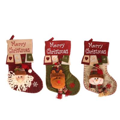 China Popular New Arrival Wholesale Custom Cotton Christmas Gift Candy Bag Santa Velvet Village Style Christmas Snowman Sock Canvas Stockings for sale