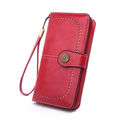 China Hot Fashionable Women's Ladies RFID Wallets Retro Long Pinch Multifunctional Cell Phone Bag Wallet Leather Women for sale