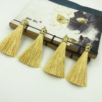 China Durable Cosmetic Bottle Decoration Small Perfume Bag Tassels Striped Earrings Gold Wire Metal Tassels Custom Shaped PVC Keychain Tassels for sale