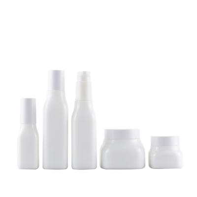 China Personal Care 50g 150g 50ml 100ml Opal White Ceramic Glass Pump Bottle Set For Cosmetic for sale