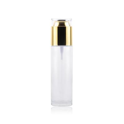 China Luxury Empty Personal Care Glass Spray Cream Bottle Cosmetic Packaging Pump Container With Gold Or Silver Lid for sale