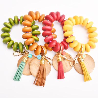 China Wooden Beads Bracelet Bangle Key Chain Blank Personalized Engraved Colorful Tassel Key Chain Boho Key Chain For Her for sale