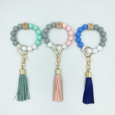 China Boho Silicone Eco-Friendly Ring Bracelet Portable House Car Key Locks Tassel Ring Holder Monogrammed Beaded Wrislet Keychains for sale